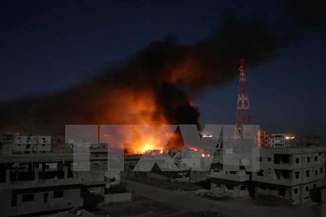 Khói bốc lên sau cuộc không kích ở Daraa, Syria ngày 9-6. (Nguồn: AFP/TTXVN)