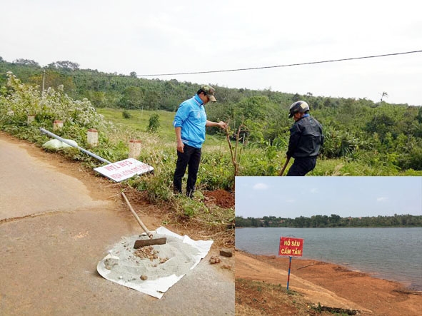 Thanh niên thị trấn Quảng Phú lắp đặt biển cảnh báo đuối nước tại một con suối trên địa bàn. 