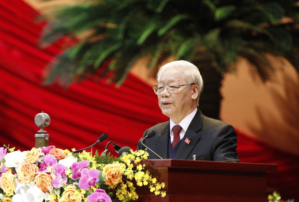 Tổng Bí thư, Chủ tịch Nước Nguyễn Phú Trọng trình bày Báo cáo của Ban Chấp hành Trung ương Đảng Khóa XII về các văn kiện trình Đại hội XIII của Đảng.