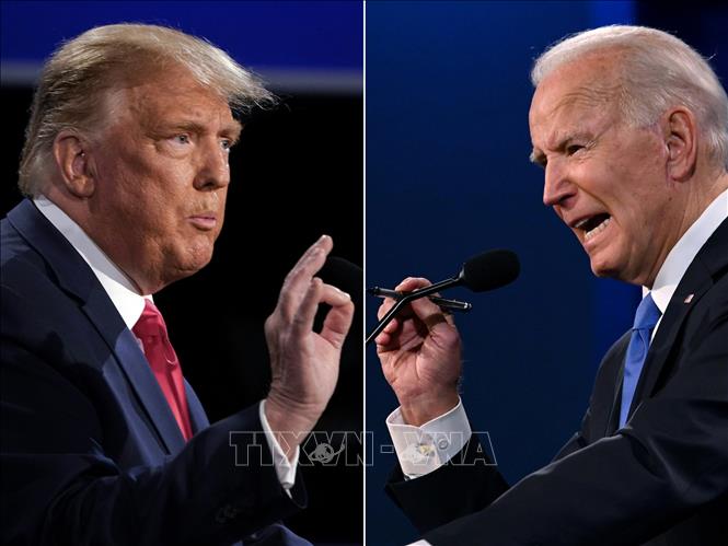 Ứng cử viên Joe Biden (phải) của đảng Dân chủ và Donald Trump bên phía đảng Cộng hòa. Ảnh tư liệu: AFP/TTXVN