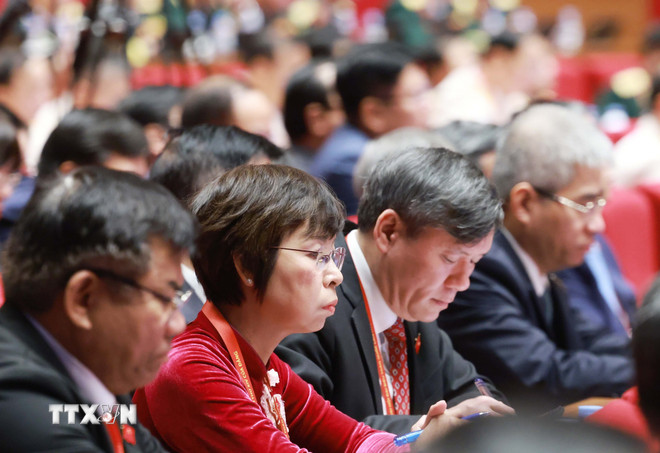 Các đại biểu dự phiên thảo luận tại hội trường về các văn kiện Đại hội, sáng 21/1. Ảnh: TTXVN