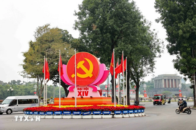 The hammer-and-sickle emblem, Party flag and national flag are prominently displayed at the Dien Bien Phu - Doc Lap - Chu Van An intersection in Hanoi to mark the 14th National Congress of the Communist Party of Vietnam. Photo: VNA