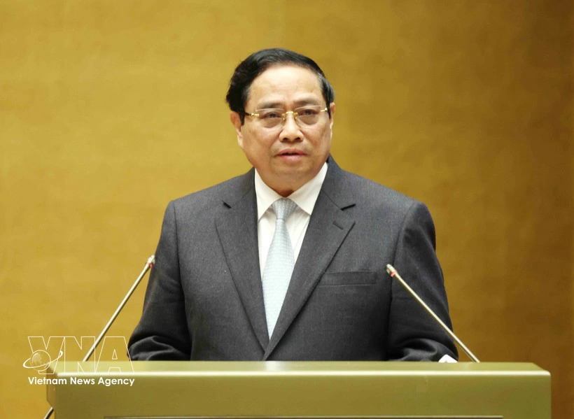 Prime Minister Pham Minh Chinh presents the action plan for implementing the Resolution of the 14th National Party Congress at the conference on February 7. (Photo: VNA)