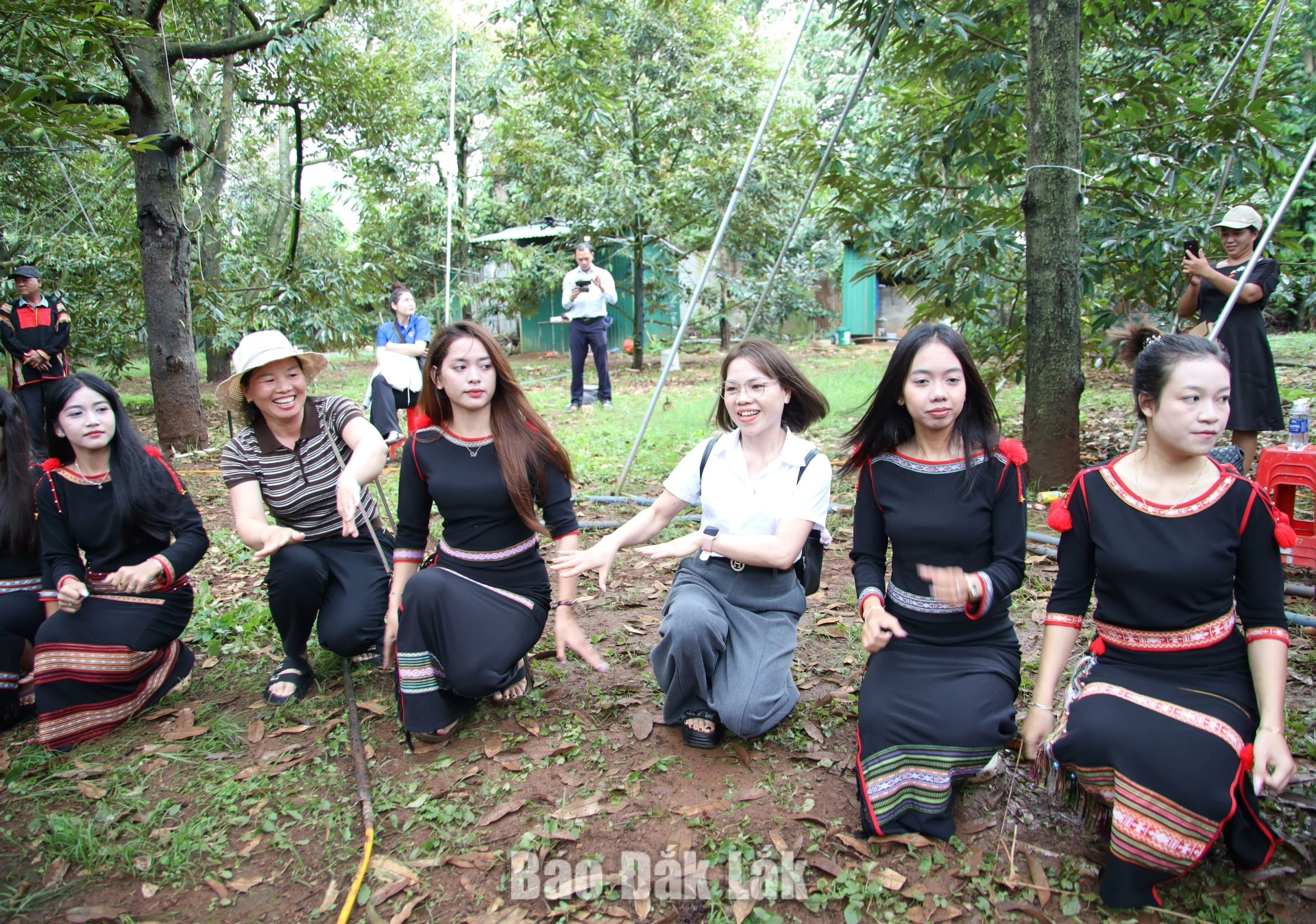 Visitors join local residents in cultural performances at durian orchards during the festival season.