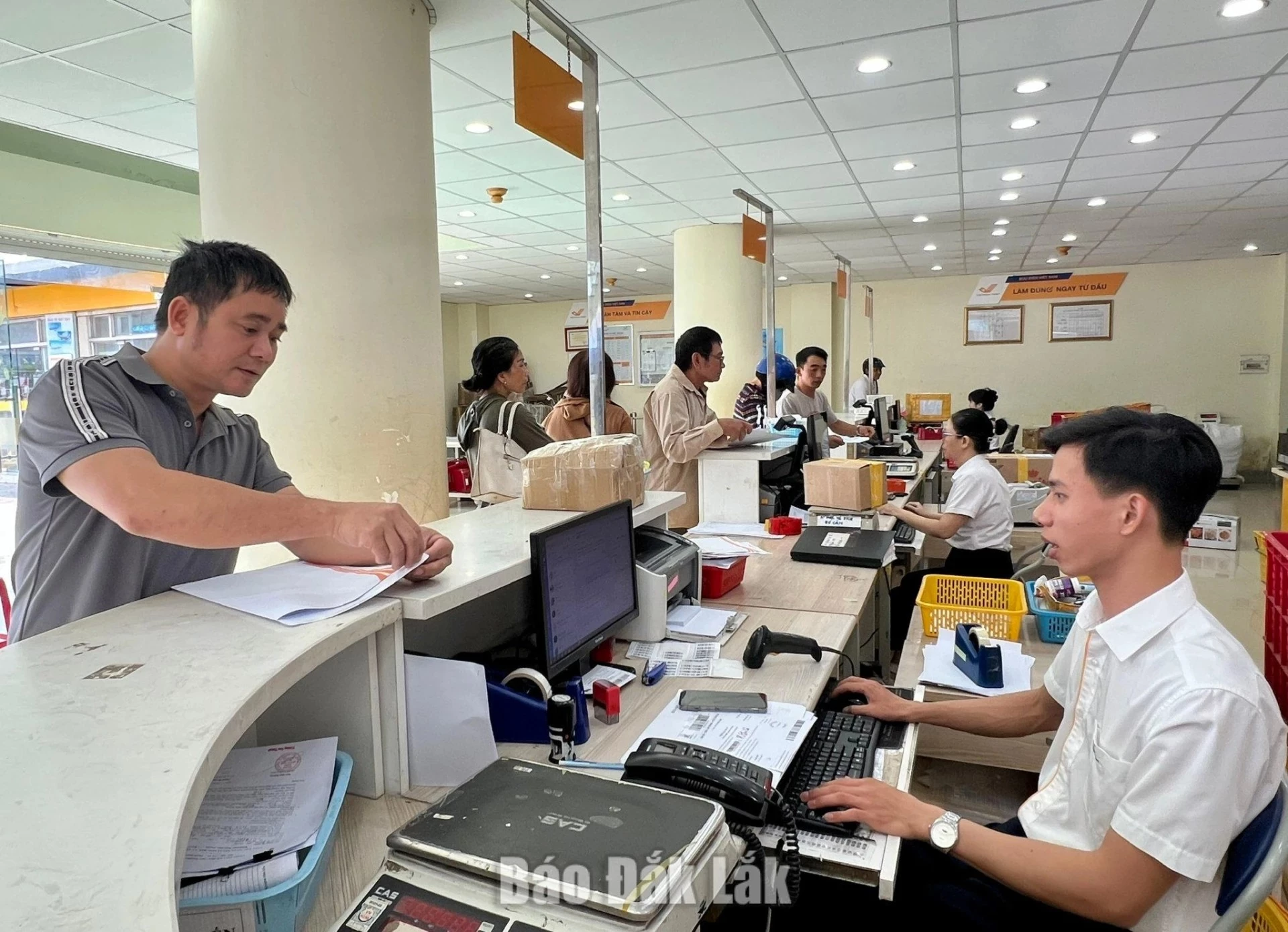Residents using services at a provincial Post Office transaction point, Buon Ma Thuot Ward.