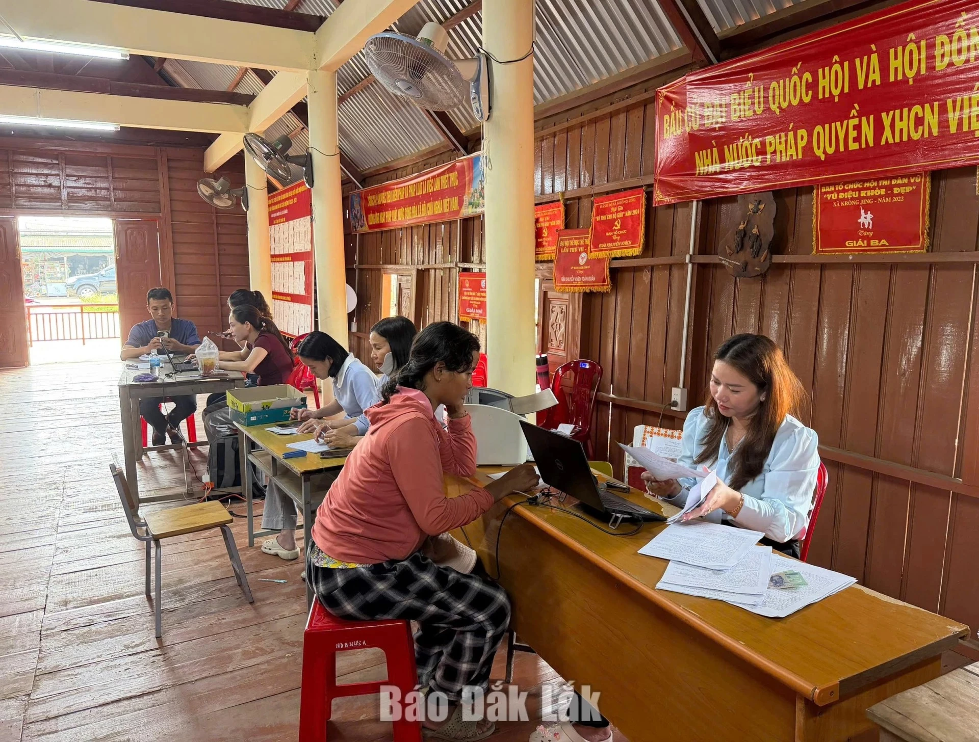 Officials in M’Drak Commune receiving and processing information from residents for land database development.