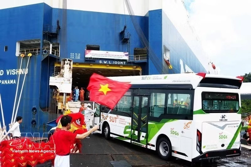 Kim Long Motor’s all-electric buses are loaded onto a vessel at Chan May Port in Hue city for export to Thailand. Photo: VNA