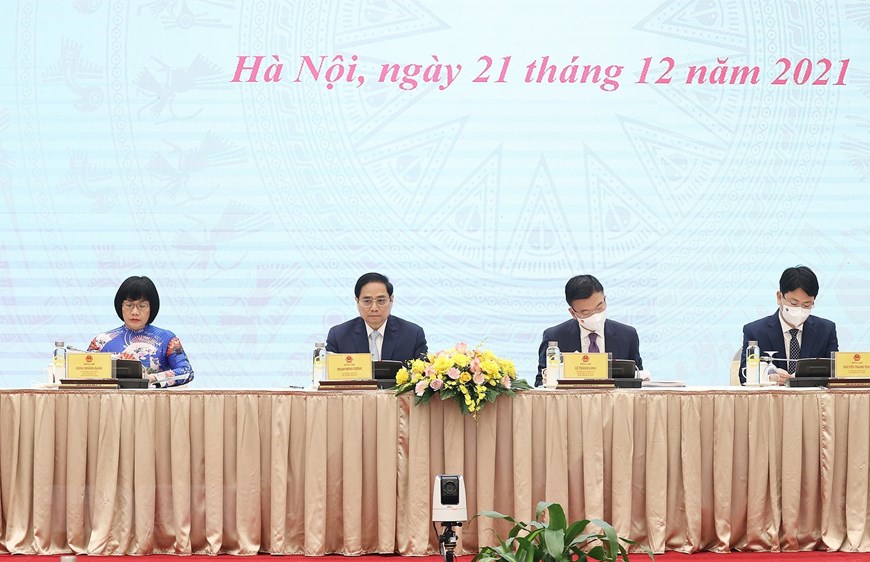 Thủ tướng Chính phủ Phạm Minh Chính, Bộ trưởng Bộ Tư pháp Lê Thành Long cùng các Thứ trưởng Bộ Tư pháp chủ trì hội nghị. Ảnh: TTXVN