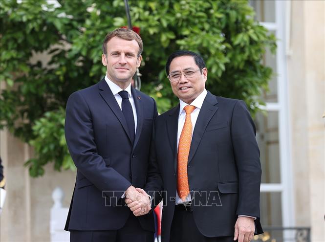 Tổng thống Pháp Emmanuel Macron và Thủ tướng Phạm Minh Chính. Ảnh: Dương Giang/TTXVN