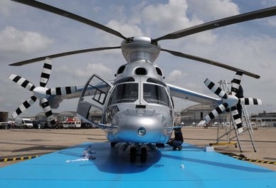 Technicians prepare a Eurocopter X3 helicopter at the Le Bourget Air show, outside Paris, on June 14. The air show opens on June 17, 2013. AFP PHOTO / ERIC PIERMONT (Photo credit should read ERIC PIERMONT/AFP/Getty Images)